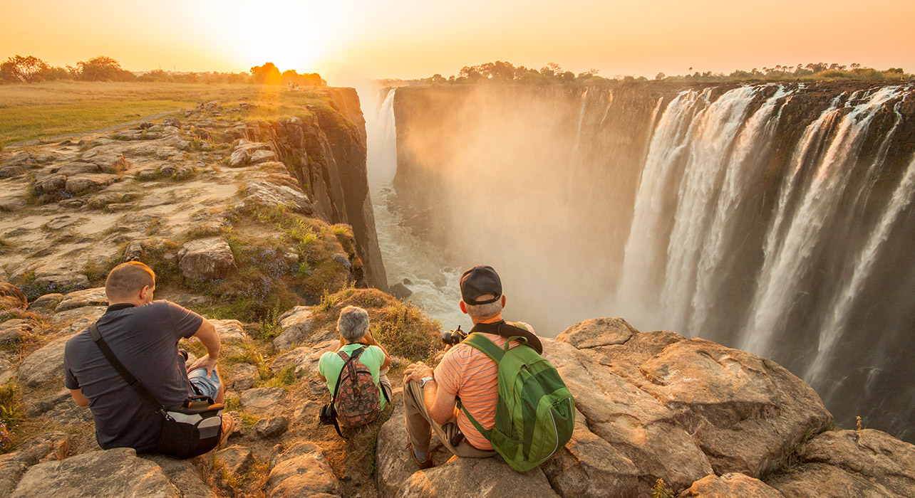 1-slide-south-africa-zimbabwe-travelers-enjoying-victoria-falls-pano.jpg